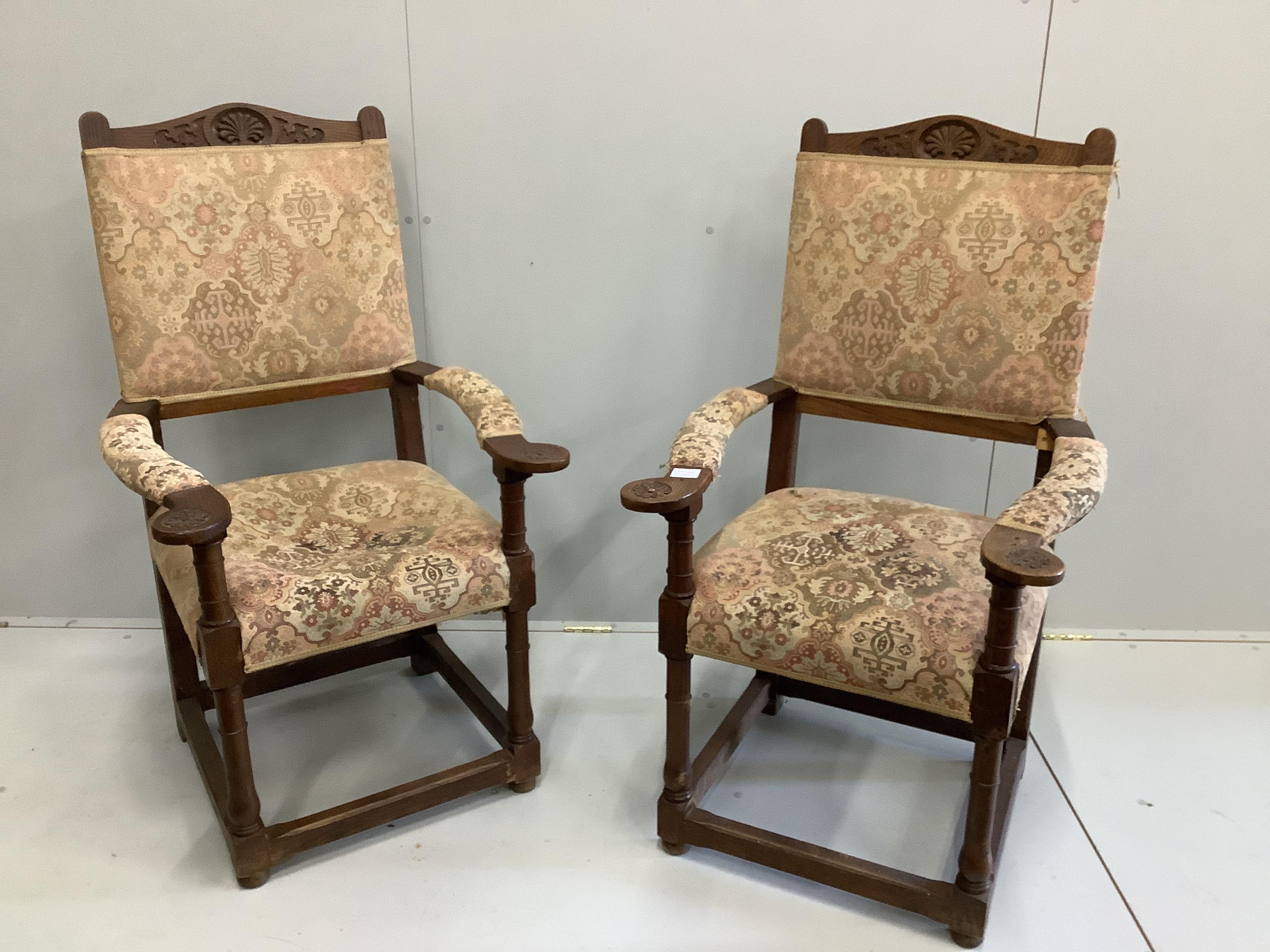 A pair of oak elbow chairs, width 64cm, depth 60cm, height 114cm